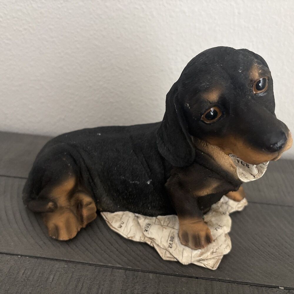 Lying Dachshund With Newspaper Coin Piggy Bank Dog Resin Figurine Black Brown